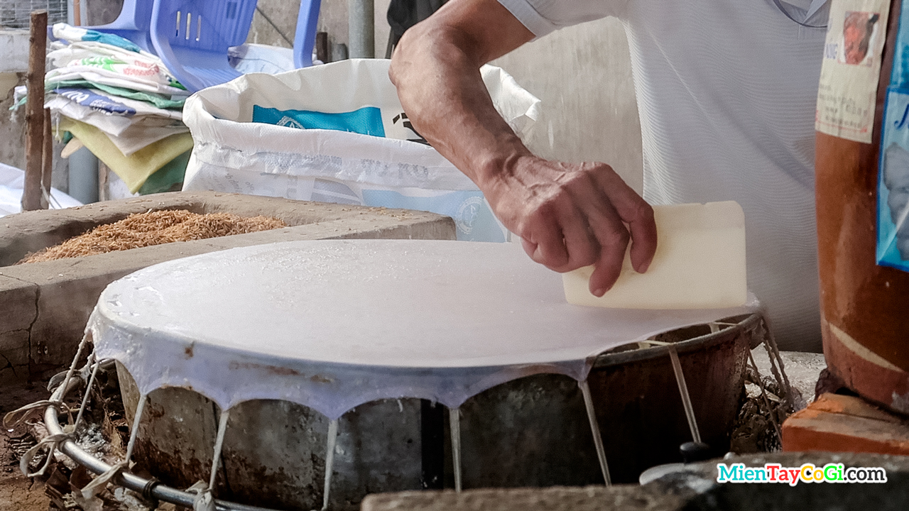 Pouring flour to make  noodle in Can Tho factory